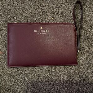 kate spade Wine Leather Wristlet with Gold Logo